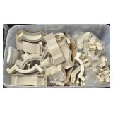 large tub of plastic trim pieces for metal awnings