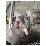 Seven concrete trowels