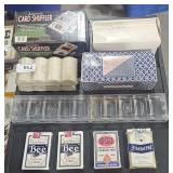 Card shuffler, poker chips, playing cards