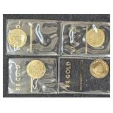 (4)  8KT GOLD MINI WORLD TOKEN 0.11 GRAMS EACH