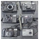Assortment of vintage cameras and such