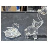 Two crystal figurines, swan, elephant