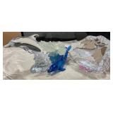 Clear glass Dolphins & Blue Plastic has a broken s