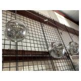 Three decorative silver balls