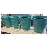 4  teal plastic smaller pots 4x$