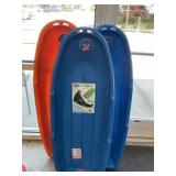 3 multi colored sleds