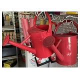 2 red watering cans