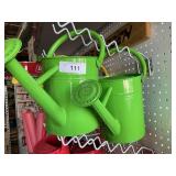2 green watering cans