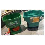 2 handheld seed/ fertilizer spreaders.
