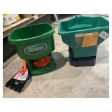 2 handheld seed/ fertilizer spreaders.