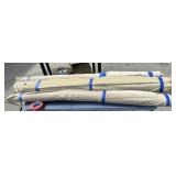 3 partial rolls of beige fabric