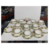 10 Tea Cups. 11 Saucers, Cream & Sugar Bowl,