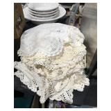 Stack of Crocheted Doilies and Table Covers