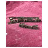 Pewter train Individual pieces on a track