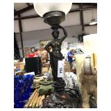 Metal Lady Holding Lamp on Head
