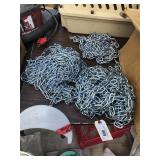 3 piles of various links of chain