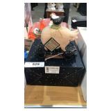 Pig with its chicken figurine