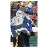 Three partial bags of a oil absorb