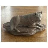 Decorative plastic wolf on rock