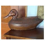 Hand carved wooden duck has been repaired