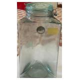 T - VTG GLASS JAR W/LIBERTY HALF DOLLAR (L21