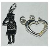 A PAIR OF STERLING SILVER PENDANTS