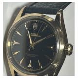 AN AUTHENTIC GOLD ROLEX WATCH 34MM