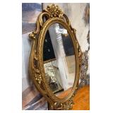 440 - ORNATELY FRAMED OVAL WALL MIRROR 28'L