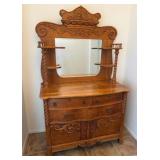 15 - ANTIQUE OAK SIDEBOARD WITH CARVED DETAILS