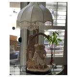 431 - TABLE LAMP WITH FIGURAL BASE & FRINGED SHADE