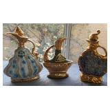 F - LOT OF THREE CERAMIC DECANTERS (L135)