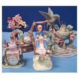 489 - FOUR COLLECTIBLE FIGURINES (N32)