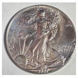 1987 - 1oz FINE SILVER AMERICAN EAGLE $1 (656 D)