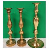 11 - THREE BRASS CANDLESTICKS (D105)