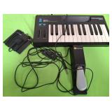 11 - NOVATION 10-XMINI KEYBOARD AND ACCESORIES