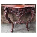 11 - CARVED WOOD DEMI LUNE TABLE