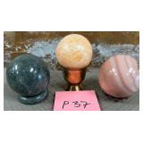 11 - THREE POLISHED STONE ORBS (P37)