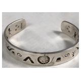 443 - SILVER STORY CUFF BRACELET SIGNED (J121)