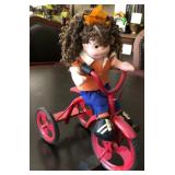 J1 - VINTAGE DOLL ON TRICYCLE TOY (D220)