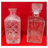 J4 - LOT OF 2 CUT GLASS DECANTERS (K25)