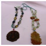 538 - TWO CARVED STONE PENDANTS W/ BEADS (N119)