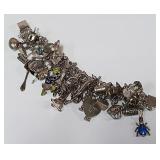 722 -STERLING BRACELET W/CHARMS(55)
