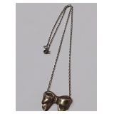 722 -STERLING NECKLACE W/BOW PENDANT(116)