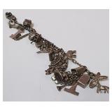 722 -STERLING BRACELET W/CHARMS (88)