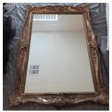722 - FRAMED MIRROR 42"L