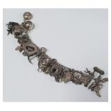 722 -STERLING BRACELET W/CHARMS(2)