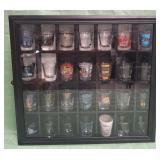 11 - COLLECTION OF SHOT GLASSES IN DISPLAY (C43)