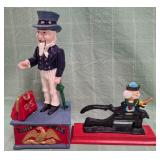11 - TWO CAST IRON COIN BANKS (D73)