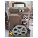 11 - VINTAGE BELL & HOWELL MOVIE PROJECTOR (S69)