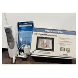 430 - NEW WATERPIK AND DIGITAL FRAME